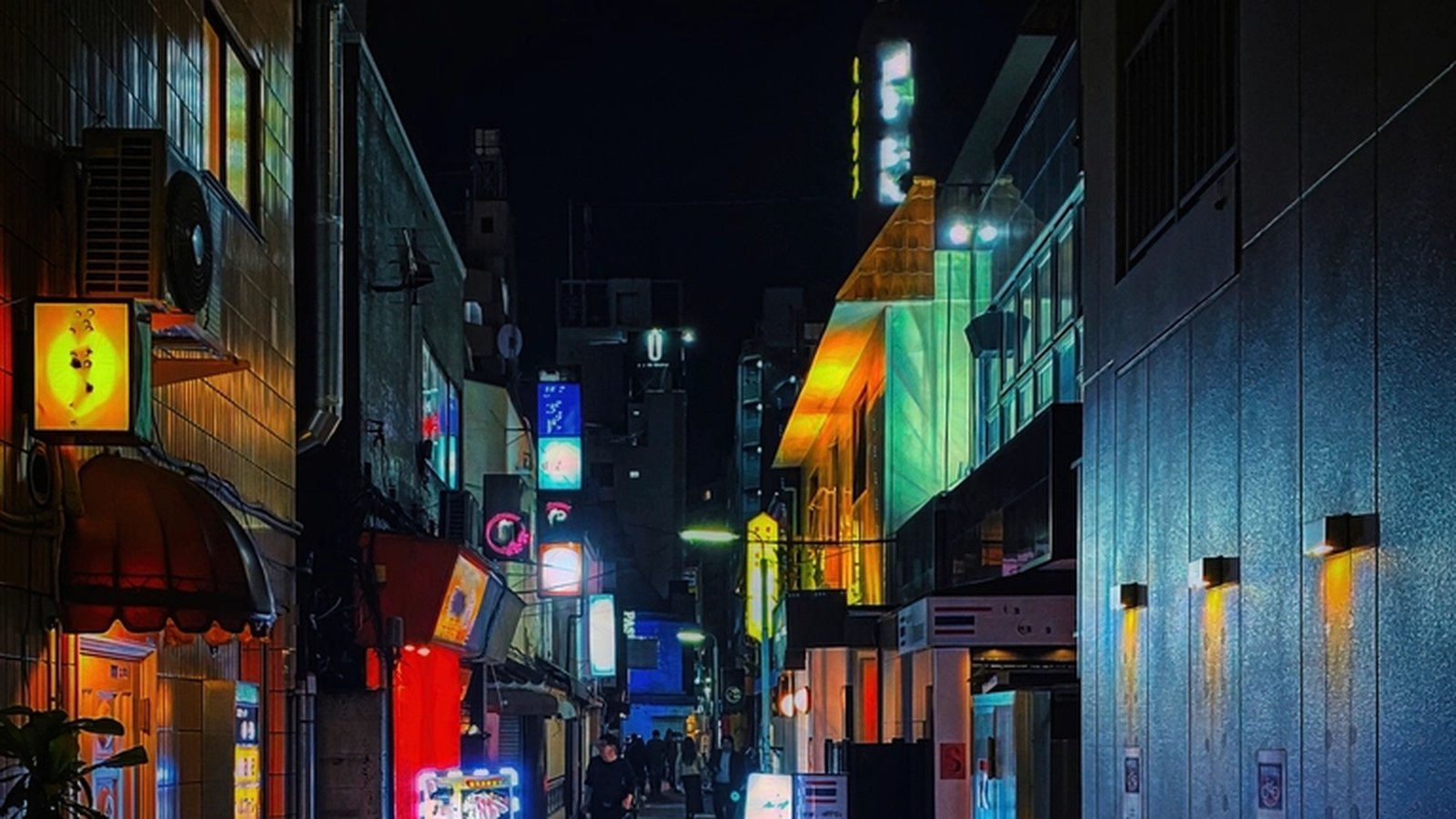 Narrow Tokyo alley at night lit by cyan, green and amber neon signage on both sides
