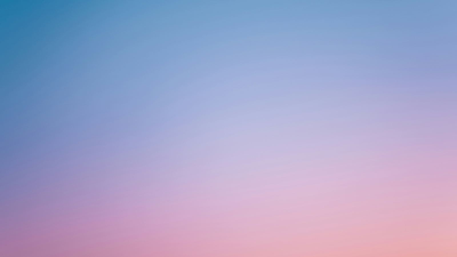 Soft pastel pink and blue gradient sky at dusk